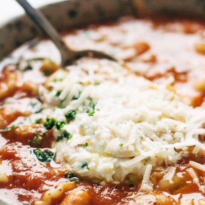 White Bean Lasagna Soup in a bowl with a spoon.