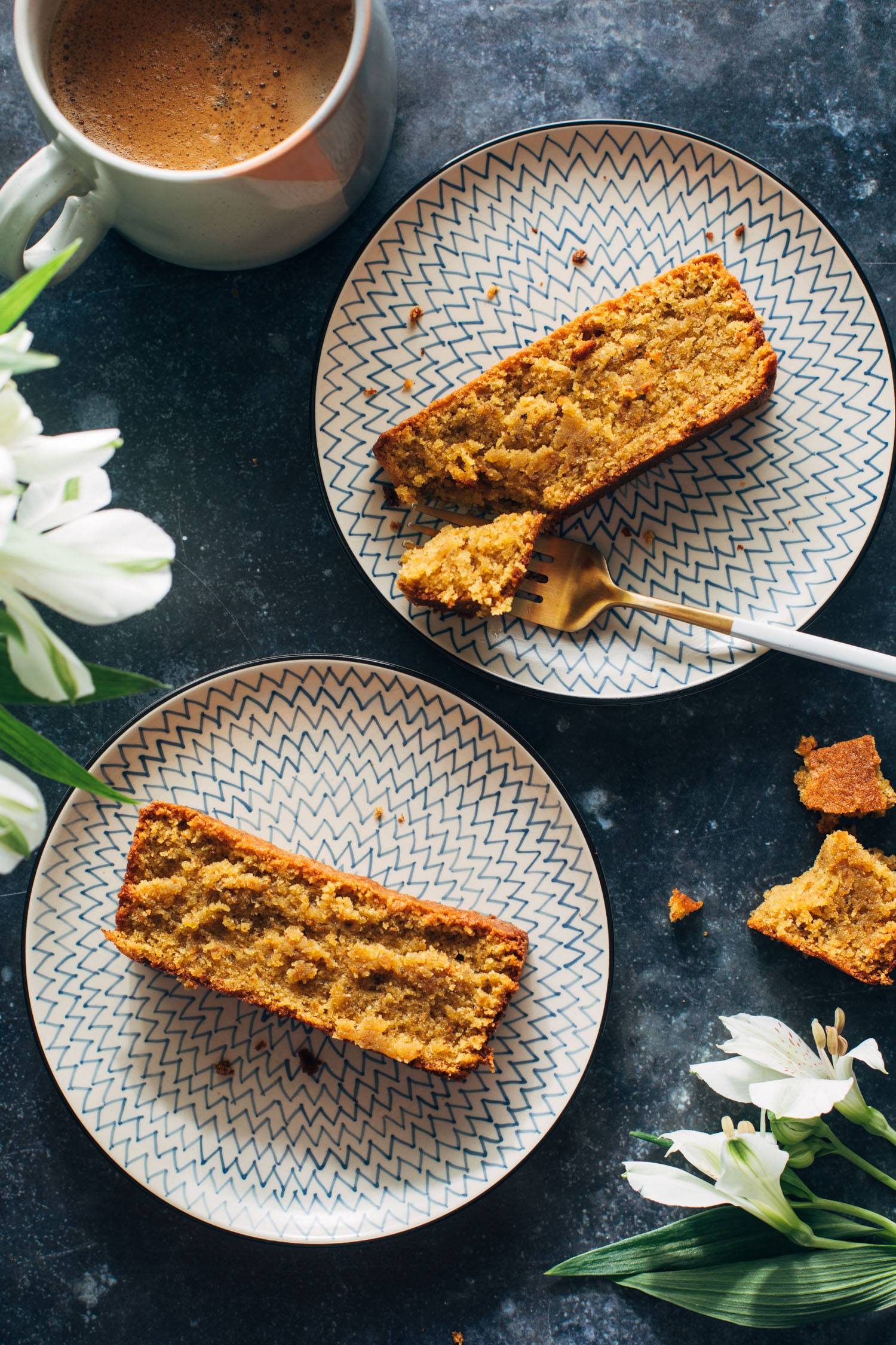 Taking a bite of a slice of pistachio loaf.