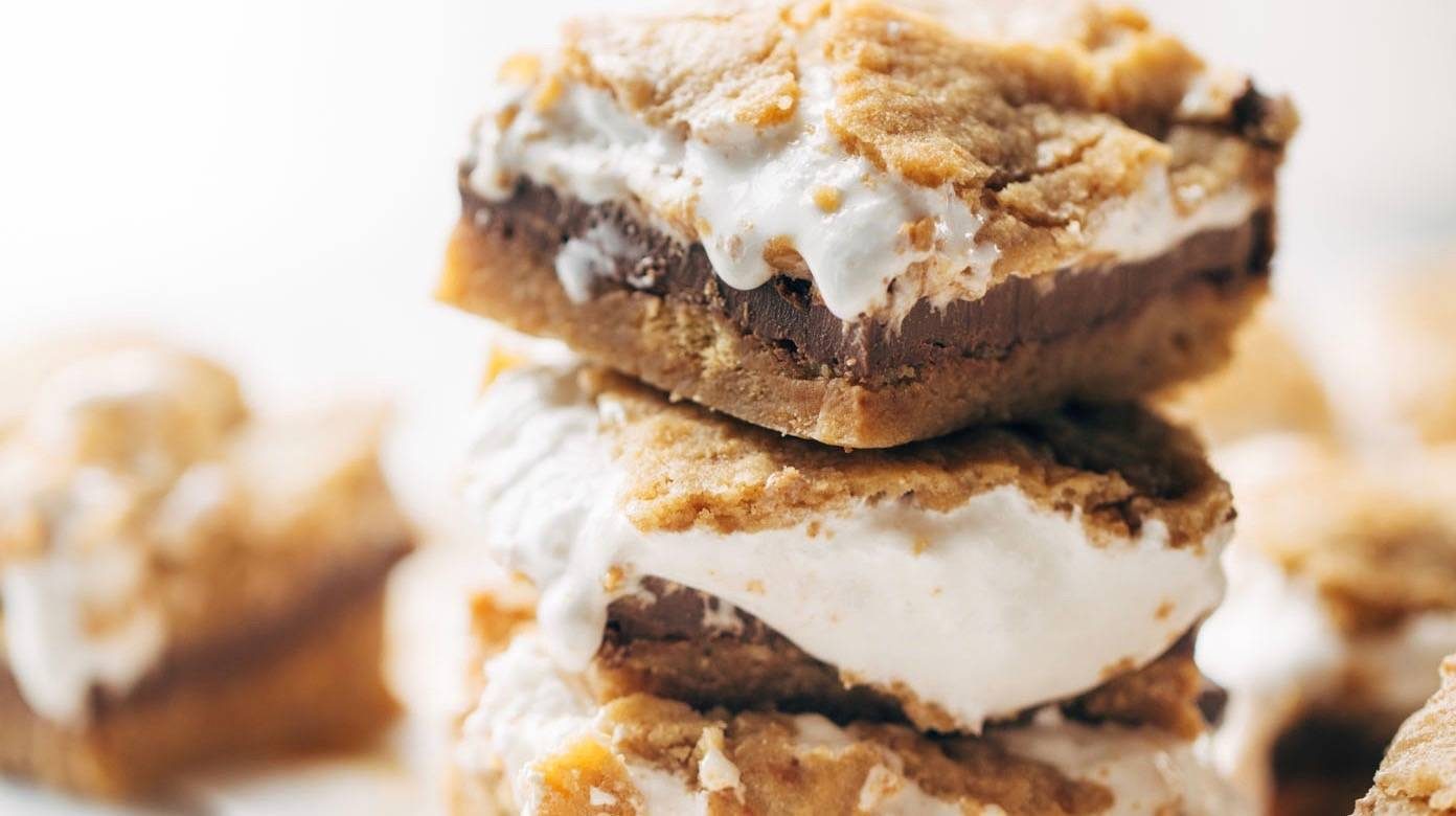 S'Mores Bars in stack with melted marshmallows.