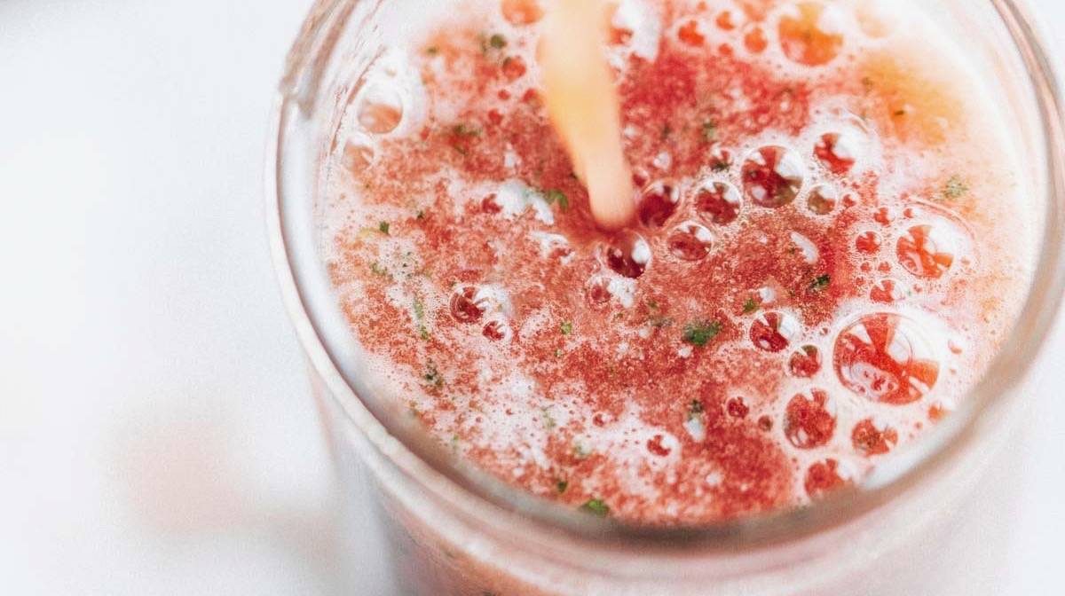 Watermelon Smoothie being poured into a glass.