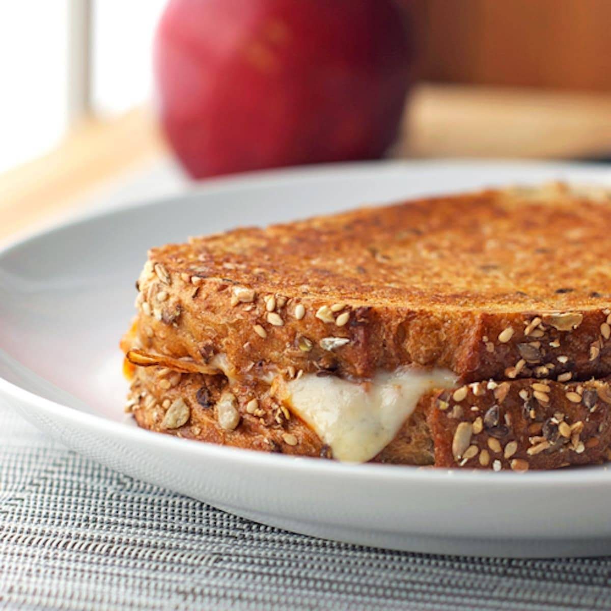 Grilled cheese sandwich stuffed with bacon, pear slices, and raspberry preserves.