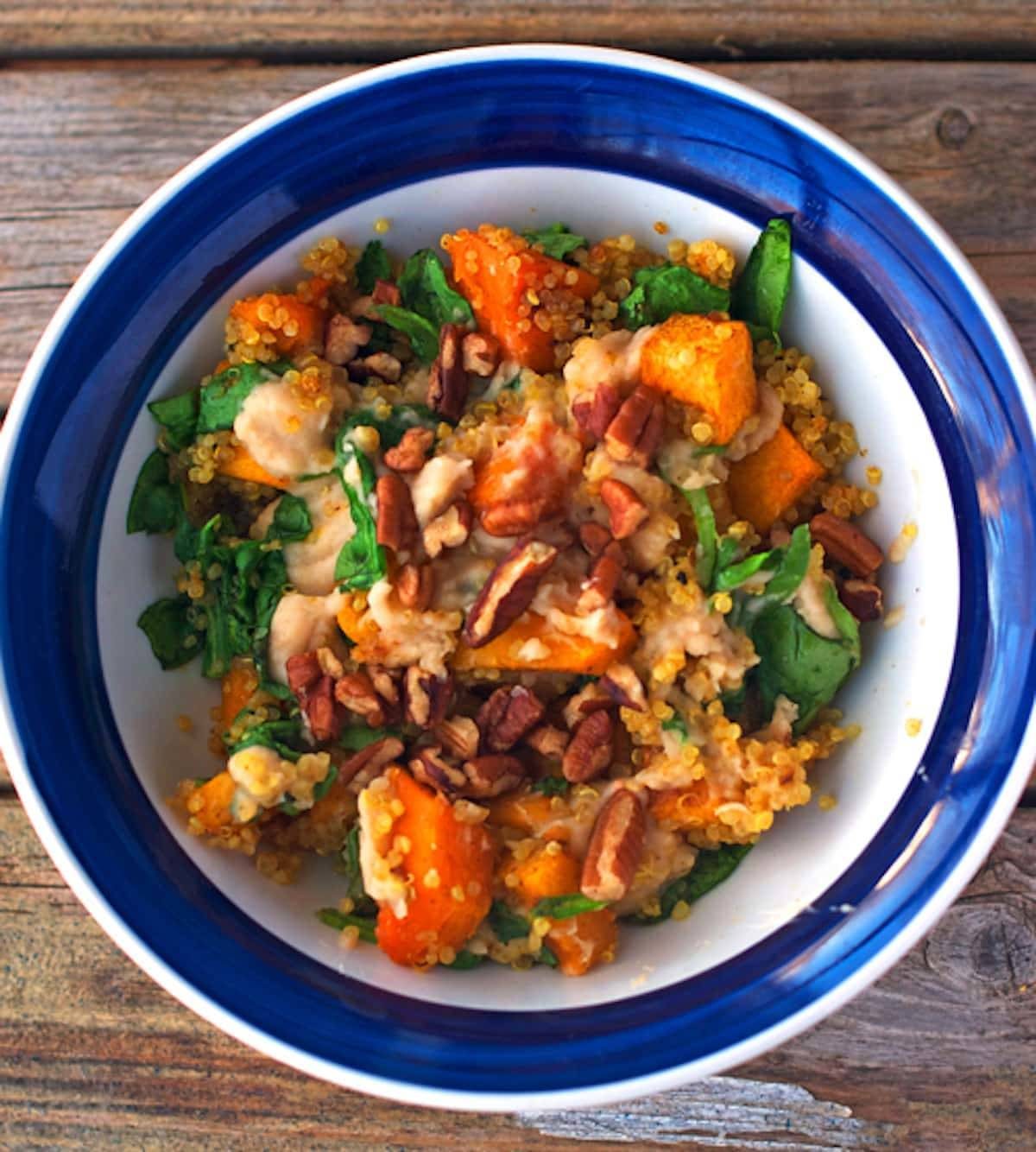 Sweet quinoa squash bowl in a blue bowl.