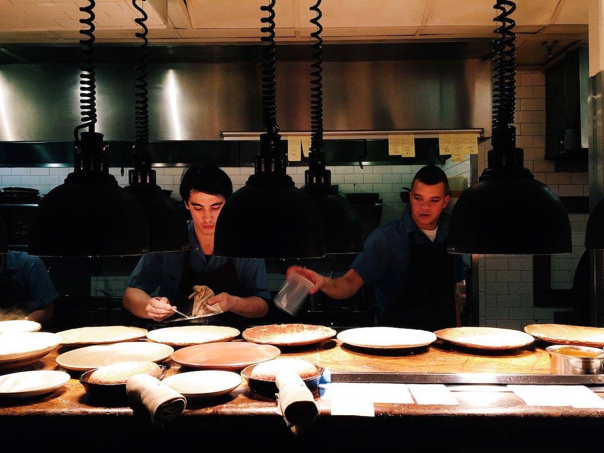 Men cooking.